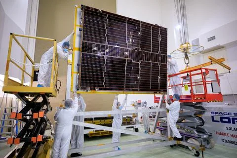 Psyche Solar Array Unboxing. A NASA team helps attach solar arrays for the .. Stock Photos
