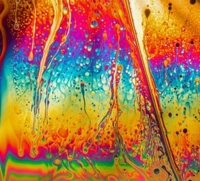 Psychedelic abstract background formed by soap bubble reflecting light Stock Photos