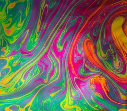 Psychedelic abstract background formed by soap bubble reflecting light Stock Photos