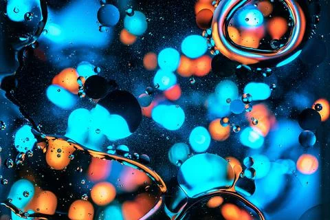 Psychedelic abstract fluid background with flowing big bubbles and bokeh ligh Stock Photos