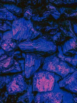 Psychedelic Deep Blue Pink Stone Rubble Wall Close Up Dark Abstract Texture.. Stock Photos
