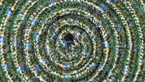 A psychedelic disc made of a green cord is spinning on a turntable, top view, cl 스톡 동영상 161899492