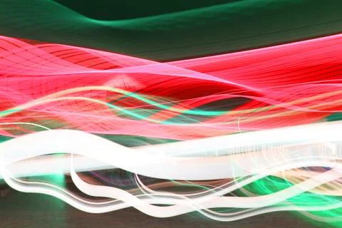 Psychedelic gradient bright red, orange, yellow colors on a dark background Stock Photos