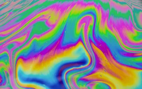 Psychedelic multicolored patterns background. Photo macro shot of soap bubble Stock Photos