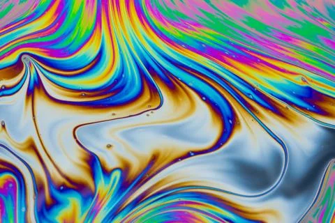 Psychedelic multicolored patterns background. Photo macro shot of soap bubble Stock Photos