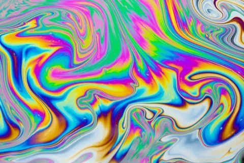 Psychedelic multicolored patterns background. Photo macro shot of soap bubble Stock Photos