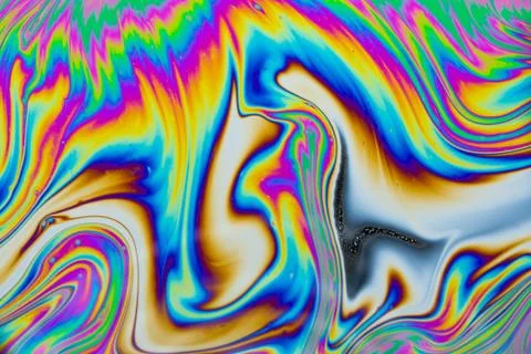 Psychedelic multicolored patterns background. Photo macro shot of soap bubble Stock Photos