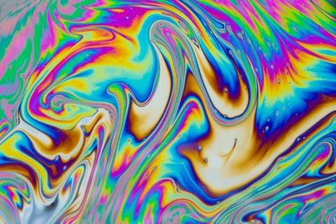 Psychedelic multicolored patterns background. Photo macro shot of soap bubble Stock Photos
