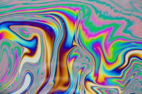 Psychedelic multicolored patterns background. Photo macro shot of soap bubble Stock Photos