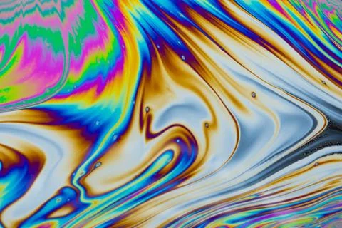 Psychedelic multicolored patterns background. Photo macro shot of soap bubble Stock Photos