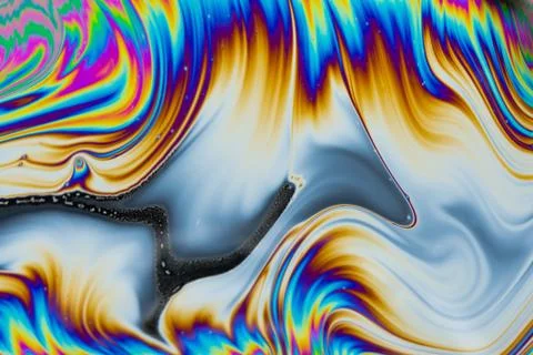 Psychedelic multicolored patterns background. Photo macro shot of soap bubble Stock Photos