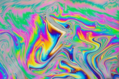 Psychedelic multicolored patterns background. Photo macro shot of soap bubble Stock Photos