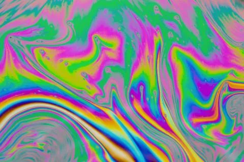 Psychedelic multicolored patterns background. Photo macro shot of soap bubble Stock Photos