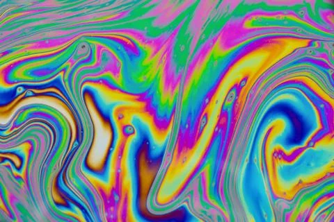 Psychedelic multicolored patterns background. Photo macro shot of soap bubble Stock Photos