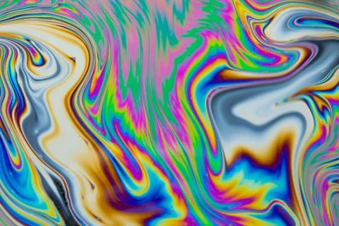Psychedelic multicolored patterns background. Photo macro shot of soap bubble Stock Photos