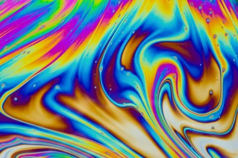 Psychedelic multicolored patterns background. Photo macro shot of soap bubble Stock Photos
