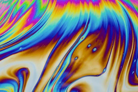 Psychedelic multicolored patterns background. Photo macro shot of soap bubble Stock Photos