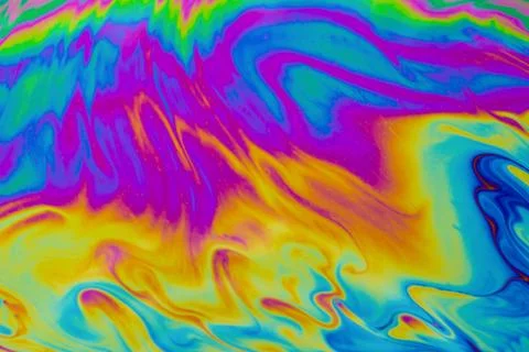 Psychedelic multicolored patterns background. Photo macro shot of soap bubble Stock Photos