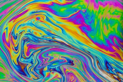 Psychedelic multicolored patterns background. Photo macro shot of soap bubble Stock Photos