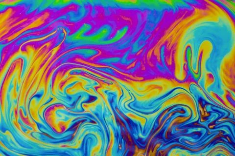 Psychedelic multicolored patterns background. Photo macro shot of soap bubble Stock Photos