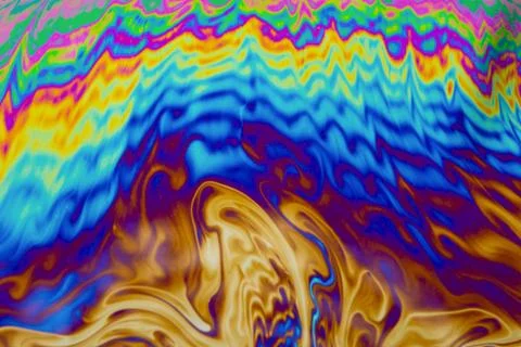 Psychedelic multicolored patterns background. Photo macro shot of soap bubble Stock Photos