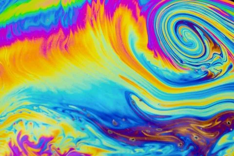 Psychedelic multicolored patterns background. Photo macro shot of soap bubble Stock Photos