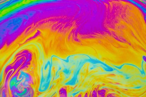 Psychedelic multicolored patterns background. Photo macro shot of soap bubble Stock Photos