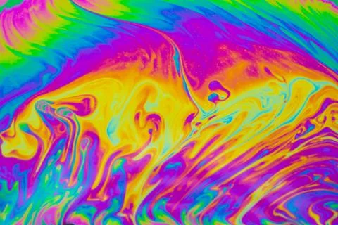 Psychedelic multicolored patterns background. Photo macro shot of soap bubble Stock Photos