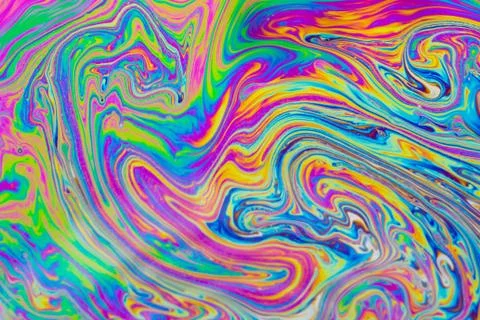 Psychedelic multicolored patterns background. Photo macro shot of soap bubble Stock Photos