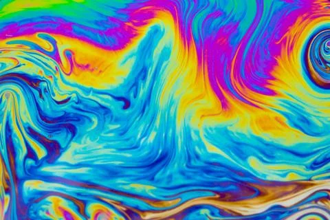 Psychedelic multicolored patterns background. Photo macro shot of soap bubble Stock Photos