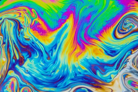 Psychedelic multicolored patterns background. Photo macro shot of soap bubble Stock Photos