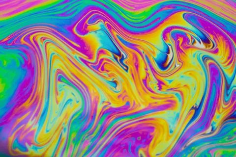 Psychedelic multicolored patterns background. Photo macro shot of soap bubble Stock Photos
