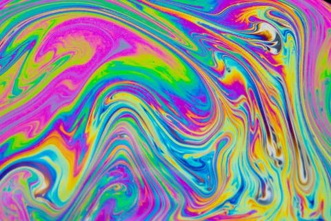 Psychedelic multicolored patterns background. Photo macro shot of soap bubble Stock Photos