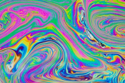 Psychedelic multicolored patterns background. Photo macro shot of soap bubble Stock Photos