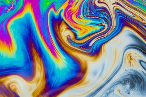 Psychedelic multicolored patterns background. Photo macro shot of soap bubble Stock Photos