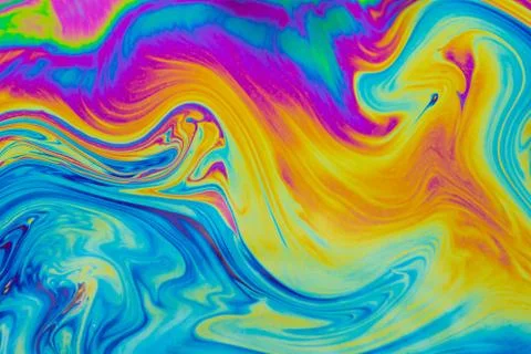 Psychedelic multicolored patterns background. Photo macro shot of soap bubble Stock Photos