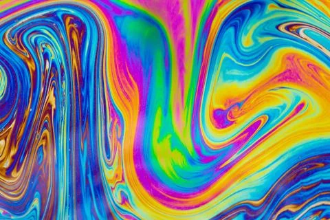 Psychedelic multicolored patterns background. Photo macro shot of soap bubble Stock Photos
