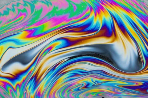 Psychedelic multicolored patterns background. Photo macro shot of soap bubble Stock Photos