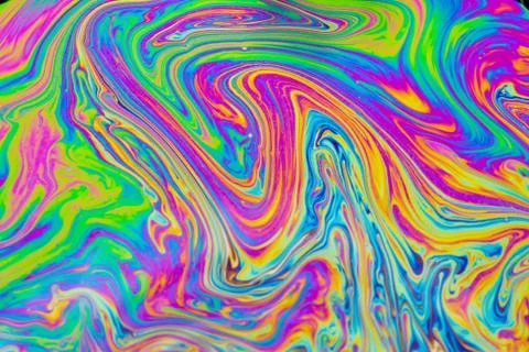 Psychedelic multicolored patterns background. Photo macro shot of soap bubble Stock Photos