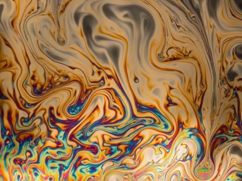 Psychedelic patterns formed on the surface of soap bubbles Stock Photos