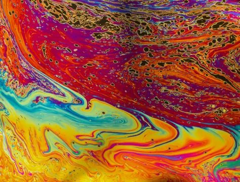 Psychedelic patterns formed on the surface of soap bubbles Stock Photos