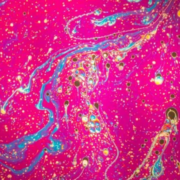 Psychedelic patterns formed on the surface of soap bubbles Stock Photos