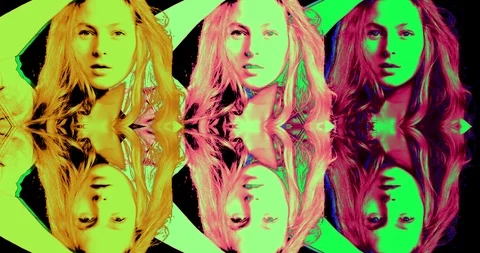 Psychedelic perception portrait of a girl of different colors dancing on a black Stock Footage 126329598