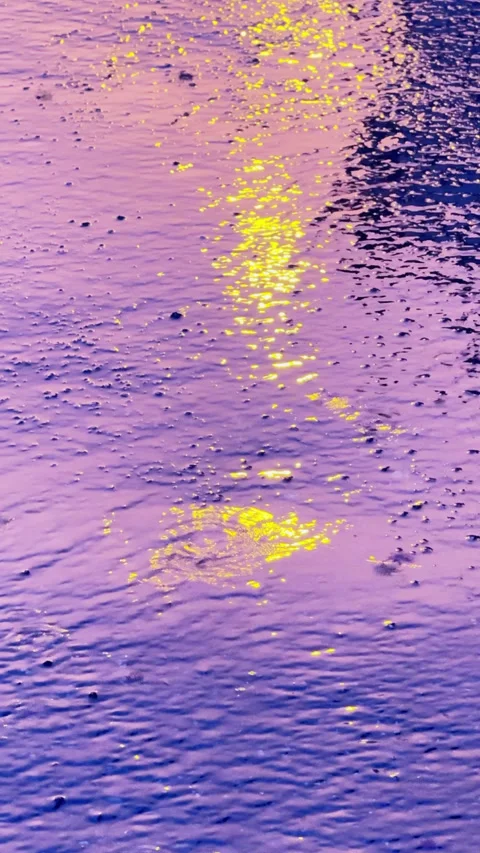 Psychedelic raindrops falling into a puddle Stock Footage 341772260