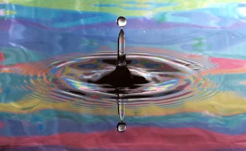 Psychedelic stop motion water drop Stock Photos