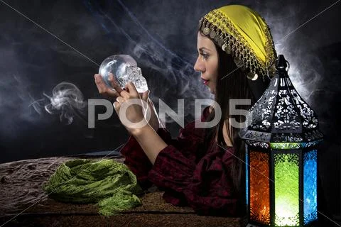 Psychic Holding a Crystal Skull Stock Photos