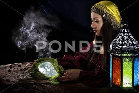 Psychic Holding a Crystal Skull Stock Photos