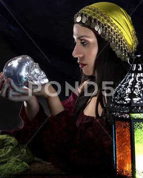 Psychic Holding a Crystal Skull Stock Photos