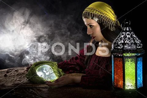 Psychic Holding a Crystal Skull Stock Photos