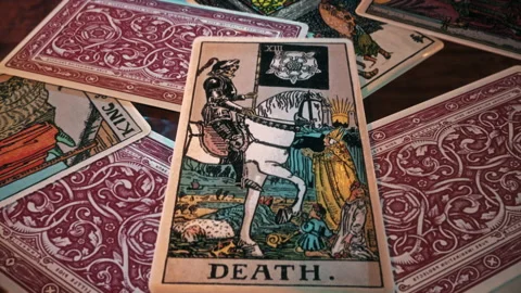 Psychic using a magic spell for change forecasting with Death tarot card Stock Footage 224901493